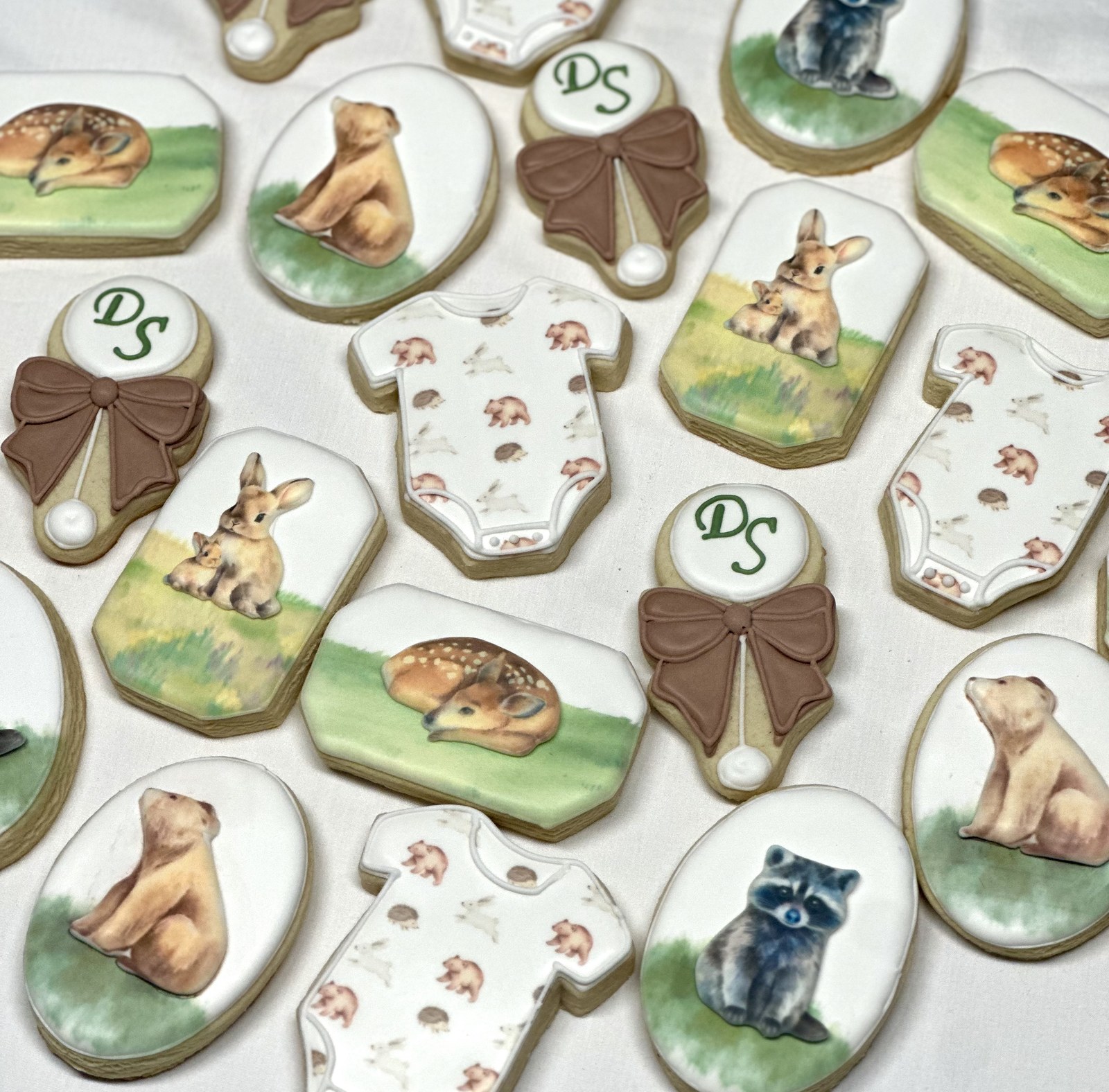 Watercolor woodland animal baby shower cookies — deer, bunny, raccoon