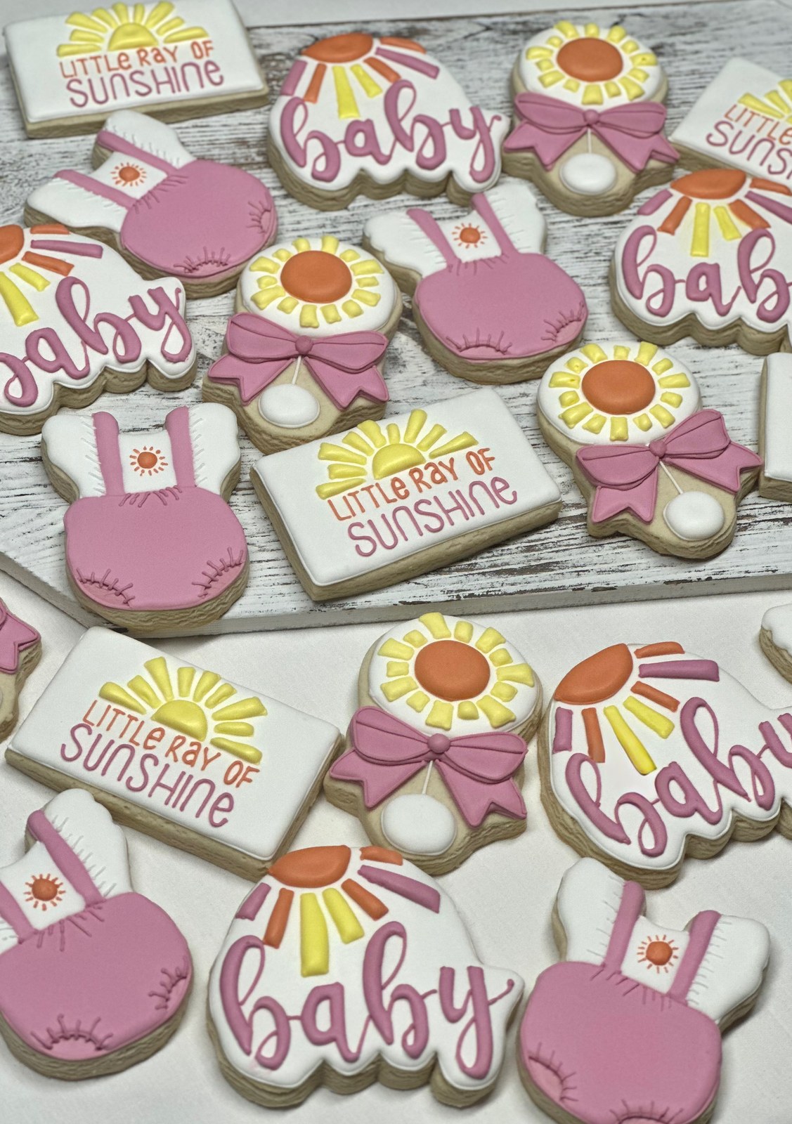 Pink and yellow Little Ray of Sunshine baby shower cookies