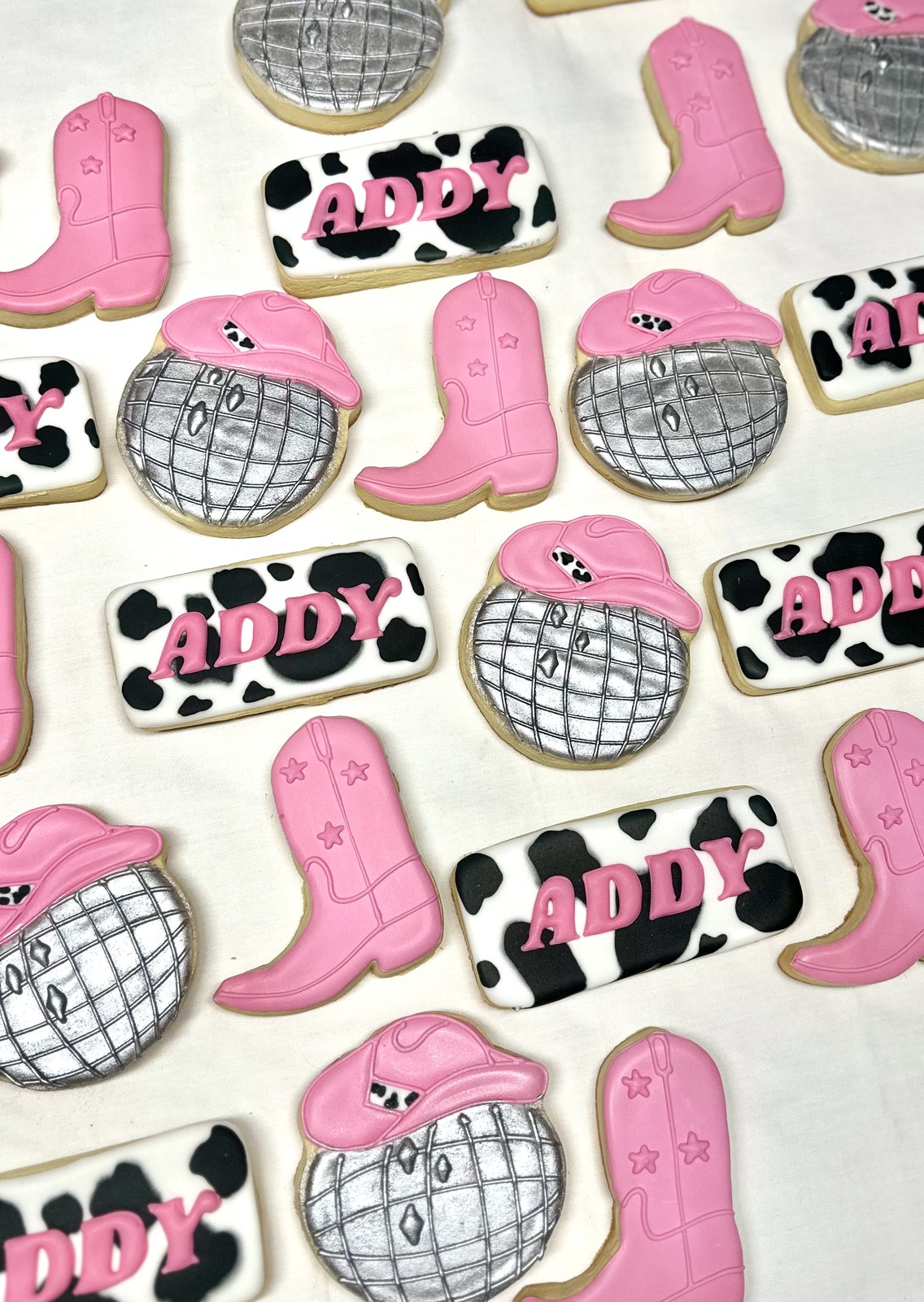 Addy Disco Cowgirl cookies — pink boots, disco ball, cow print