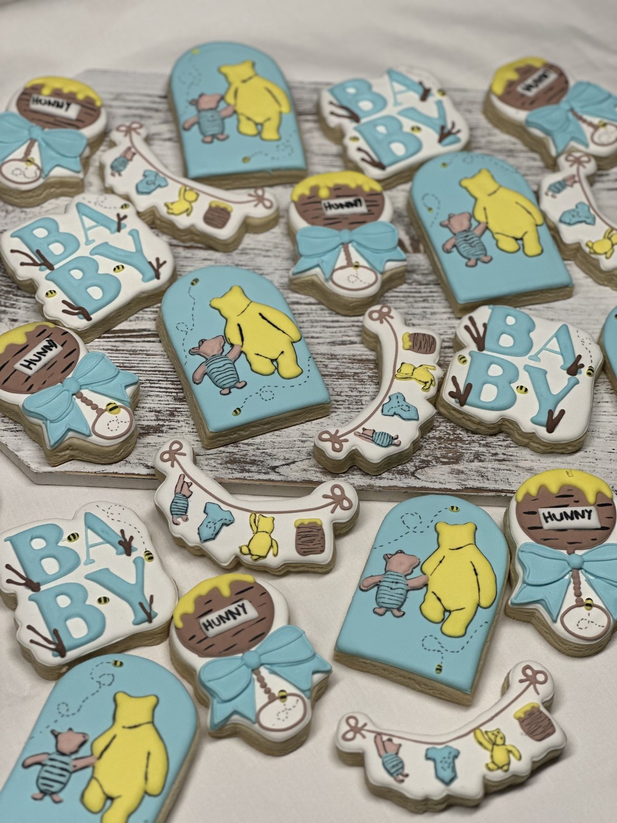 Pastel blue Winnie the Pooh baby shower cookies